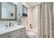 Updated bathroom with white subway tile, quartz countertop, and modern fixtures at 9211 Garrison St, Broomfield, CO 80021