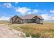 Two-story house with stone accents and a large yard at 7384 E Greenland Rd, Franktown, CO 80116