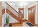 Elegant entryway with staircase, stained glass, and wood detailing at 3360 W 31St Ave, Denver, CO 80211