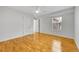 Bright bedroom with hardwood floors and ceiling fan at 1431 Tamarac St, Denver, CO 80220
