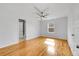 Spacious bedroom with hardwood floors and ceiling fan at 1431 Tamarac St, Denver, CO 80220