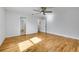 Bedroom with hardwood floors and access to bathroom at 1431 Tamarac St, Denver, CO 80220