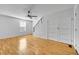 Spacious living room featuring hardwood floors and a ceiling fan at 1431 Tamarac St, Denver, CO 80220