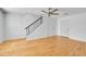 Bright living room with hardwood floors and ceiling fan at 1431 Tamarac St, Denver, CO 80220