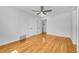 Well-lit bedroom with hardwood floors and ceiling fan at 1431 Tamarac St, Denver, CO 80220