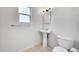 Clean bathroom featuring pedestal sink and shower at 1431 Tamarac St, Denver, CO 80220