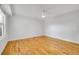 Bedroom featuring hardwood floors and a ceiling fan at 1431 Tamarac St, Denver, CO 80220
