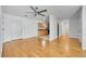 Open concept living area with hardwood floors and ceiling fan at 1431 Tamarac St, Denver, CO 80220