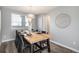 Dining area with a light wood table and six black chairs at 4181 S Shawnee St, Aurora, CO 80018