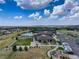 Aerial view of community center with tennis courts and pool at 8901 S Ukraine Ct, Aurora, CO 80016