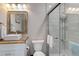Clean and updated basement bathroom with a large walk-in shower and modern vanity at 8901 S Ukraine Ct, Aurora, CO 80016