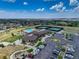 Aerial view showing community center, pool, and tennis courts at 8901 S Ukraine Ct, Aurora, CO 80016