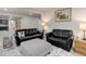 Spacious finished basement Gathering room with comfortable seating and large picture window at 8901 S Ukraine Ct, Aurora, CO 80016