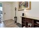 Bright and spacious entryway with hardwood floors, coat rack, and console table at 8901 S Ukraine Ct, Aurora, CO 80016