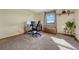 Bright home office with window and built-in shelving at 2460 Eileen Way, Parker, CO 80138