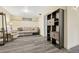 Finished basement Gathering room with comfortable seating and built-in shelving at 2460 Eileen Way, Parker, CO 80138