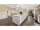 Open kitchen features a large island and breakfast bar at 2460 Eileen Way, Parker, CO 80138