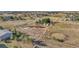 Aerial view of property with a round pen and barn at 2460 Eileen Way, Parker, CO 80138