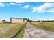 Property featuring a large yard, detached shop and driveway at 2460 Eileen Way, Parker, CO 80138