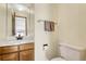 Convenient half bathroom with single vanity at 2460 Eileen Way, Parker, CO 80138