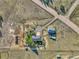 Aerial view of property showing house, detached garage, and expansive land at 2460 Eileen Way, Parker, CO 80138