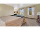 Main bedroom with ensuite bathroom and large windows at 2460 Eileen Way, Parker, CO 80138