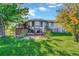 Spacious backyard with a large deck and grassy area at 2460 Eileen Way, Parker, CO 80138