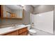 Clean bathroom with shower/tub combo and vanity at 6474 Lone Eagle Rd, Golden, CO 80403