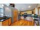 Kitchen with wood cabinets, granite countertops and stainless steel appliances at 6474 Lone Eagle Rd, Golden, CO 80403