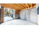 Garage with concrete floor and access to backyard at 6474 Lone Eagle Rd, Golden, CO 80403