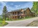 Mountain home with a large deck and attached garage; mountain setting at 6474 Lone Eagle Rd, Golden, CO 80403