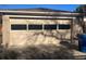 Attached single-car garage with an overhead door at 3765 Chase St, Wheat Ridge, CO 80212