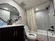 Basement bathroom with updated vanity and shower/tub at 10051 E Walsh Pl, Denver, CO 80247
