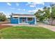 Charming blue house with a landscaped yard and solar panels at 1100 S Quitman St, Denver, CO 80219