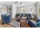 Bright living room with comfy seating and a modern coffee table at 1100 S Quitman St, Denver, CO 80219