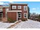 Front view of brown townhome, snow on ground at 14585 W 32Nd Ave, Golden, CO 80401