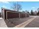 Three attached garages with brown doors at 14585 W 32Nd Ave, Golden, CO 80401