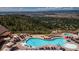 Resort-style pool with a hot tub and mountain views at 1192 Lost Elk Loop, Castle Rock, CO 80108