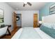 Bright bedroom with hardwood floors and a ceiling fan at 2438 W 35Th Ave # 2, Denver, CO 80211