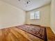 Spacious bedroom with hardwood floors and a large window at 3240 Folsom St, Boulder, CO 80304