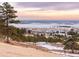 Panoramic aerial view of the property showcasing distant city skyline at 7 Canyon Pines Dr, Arvada, CO 80403