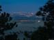 Night time view of the city lights from a mountaintop vantage point at 7 Canyon Pines Dr, Arvada, CO 80403