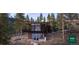 Modern home nestled in a wooded hillside setting at 7 Canyon Pines Dr, Arvada, CO 80403
