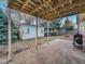 Covered back patio with view of the yard at 2450 S Deframe St, Lakewood, CO 80228