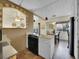 Kitchen with island and open shelving at 2450 S Deframe St, Lakewood, CO 80228