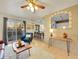 Open concept living room, view of kitchen and access to deck at 2450 S Deframe St, Lakewood, CO 80228