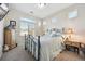 Light and airy bedroom with window and wood furniture at 18196 E 53Rd Dr, Denver, CO 80249