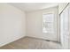 Well-lit bedroom with gray carpet and a window offering natural light at 9280 Bahama Ct, Commerce City, CO 80022