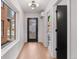 Bright entryway with modern light fixture and wood flooring at 3275 Lawrence St, Denver, CO 80205