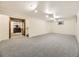 Spacious finished basement with neutral carpeting and ample natural light at 824 S Nelson Way, Lakewood, CO 80226